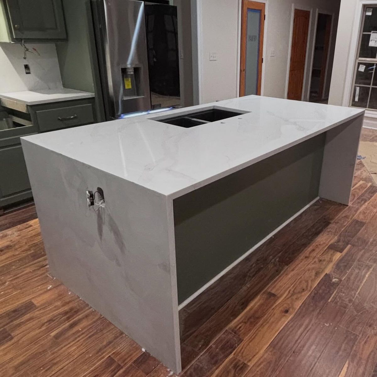 Granite L-shaped kitchen countertop installation Clinton MS